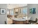 Modern kitchen with white cabinets, quartz counters, and island at 6523 Virginia Xing, University Park, FL 34201