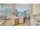 Kitchen features white cabinets, stainless steel appliances, and quartz countertops at 6523 Virginia Xing, University Park, FL 34201