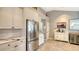 Stainless steel appliances and white cabinets in this kitchen at 6523 Virginia Xing, University Park, FL 34201