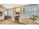 Modern kitchen with white cabinets, stainless steel appliances, and breakfast nook at 6523 Virginia Xing, University Park, FL 34201