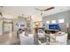 Open living space with wood dining table and access to the kitchen at 6523 Virginia Xing, University Park, FL 34201