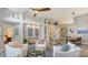 Open concept living area with a view to the kitchen and pool at 6523 Virginia Xing, University Park, FL 34201
