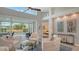 Relaxing living area with white furniture, and views to the pool area at 6523 Virginia Xing, University Park, FL 34201