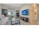 Relaxing office with large TV and plenty of natural light at 6523 Virginia Xing, University Park, FL 34201
