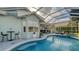 Inviting pool and patio with outdoor seating and lush landscaping at 6523 Virginia Xing, University Park, FL 34201