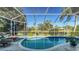 Relaxing screened pool and spa with lake view at 6523 Virginia Xing, University Park, FL 34201