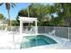 Community spa with pergola and seating for relaxation at 6523 Virginia Xing, University Park, FL 34201