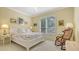 Peaceful bedroom with a floral bedspread and a rocking chair at 6525 Berkshire Pl, University Park, FL 34201