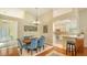 Bright dining area with hardwood floors and kitchen access at 6525 Berkshire Pl, University Park, FL 34201