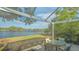 Relaxing screened patio overlooking a peaceful lake at 6525 Berkshire Pl, University Park, FL 34201