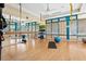 Yoga and Pilates studio with hardwood floors, wall mirrors and exercise equipment at 6525 Berkshire Pl, University Park, FL 34201