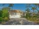 Single story house with white garage door and manicured landscaping at 6525 Berkshire Pl, University Park, FL 34201