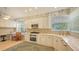 Well-equipped kitchen with white cabinets and granite counters at 6525 Berkshire Pl, University Park, FL 34201