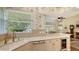 Bright kitchen features granite countertops, custom cabinetry, and a breakfast nook at 6525 Berkshire Pl, University Park, FL 34201