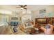 Comfortable living room with fireplace and built-in shelving at 6525 Berkshire Pl, University Park, FL 34201