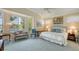 Spacious main bedroom with water views and a sitting area at 6525 Berkshire Pl, University Park, FL 34201