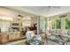 Spacious sunroom offering views of living room and backyard at 6525 Berkshire Pl, University Park, FL 34201