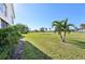 View of the green backyard and golf course at 760 Village Cir # 109, Venice, FL 34292