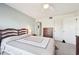 Bedroom with two twin beds, dresser, and ceiling fan at 760 Village Cir # 109, Venice, FL 34292