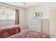 Two twin beds, a dresser, and access to bathroom at 760 Village Cir # 109, Venice, FL 34292