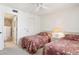 Two twin beds, a dresser, and an ensuite bathroom at 760 Village Cir # 109, Venice, FL 34292