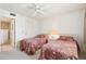 Bedroom with two twin beds and view of the bathroom at 760 Village Cir # 109, Venice, FL 34292