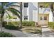 Neat condo building exterior with manicured landscaping and walkway at 760 Village Cir # 109, Venice, FL 34292