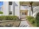 Condo building exterior showcasing entrance and landscaping at 760 Village Cir # 109, Venice, FL 34292