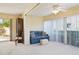 Florida room with seating area and sliding doors to patio at 760 Village Cir # 109, Venice, FL 34292