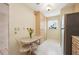 Small kitchen with stainless steel appliances and breakfast nook at 760 Village Cir # 109, Venice, FL 34292