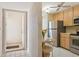 View of kitchen entry and adjacent kitchen area at 760 Village Cir # 109, Venice, FL 34292