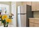 Stainless steel refrigerator in a well-lit kitchen at 760 Village Cir # 109, Venice, FL 34292