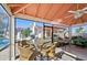 Screened lanai with table and chairs, overlooking pool at 760 Village Cir # 109, Venice, FL 34292