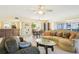 Open concept living and dining area with large windows at 760 Village Cir # 109, Venice, FL 34292