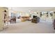 Spacious living room with fireplace, view, and dining area at 760 Village Cir # 109, Venice, FL 34292
