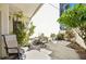 Private patio with seating and tropical plants at 760 Village Cir # 109, Venice, FL 34292