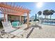 Relaxing patio area with pergola and outdoor seating at 760 Village Cir # 109, Venice, FL 34292