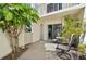 Private patio with seating and lush landscaping at 760 Village Cir # 109, Venice, FL 34292