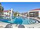 Community pool with patio furniture at 760 Village Cir # 109, Venice, FL 34292