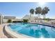 Inviting community pool with surrounding lounge chairs at 760 Village Cir # 109, Venice, FL 34292