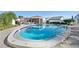 Community pool with patio furniture and a pergola at 760 Village Cir # 109, Venice, FL 34292