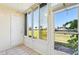 Bright sunroom with view of the golf course at 760 Village Cir # 109, Venice, FL 34292