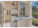 Outdoor kitchen and bar with screened enclosure at 8365 Shadow Pine Way, Sarasota, FL 34238