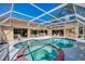 Stunning screened pool and spa with ample space for lounging at 8365 Shadow Pine Way, Sarasota, FL 34238