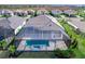 Aerial view of home showcasing a private pool and landscaped yard at 8367 Sea Glass Ct, Sarasota, FL 34240