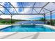 Stunning view of the pool and spa from the screened-in lanai at 8367 Sea Glass Ct, Sarasota, FL 34240