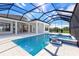 Resort-style pool with spa, sun shelf, and expansive outdoor living space at 8367 Sea Glass Ct, Sarasota, FL 34240