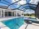 Resort-style pool area features water features, built-in spa, and spacious patio within a screened enclosure at 8367 Sea Glass Ct, Sarasota, FL 34240