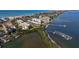 Coastal property with water access, lush landscaping, and a community pool at 8779 Midnight Pass Rd # 504H, Sarasota, FL 34242