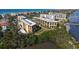 Aerial view of condo complex near the water at 8779 Midnight Pass Rd # 504H, Sarasota, FL 34242